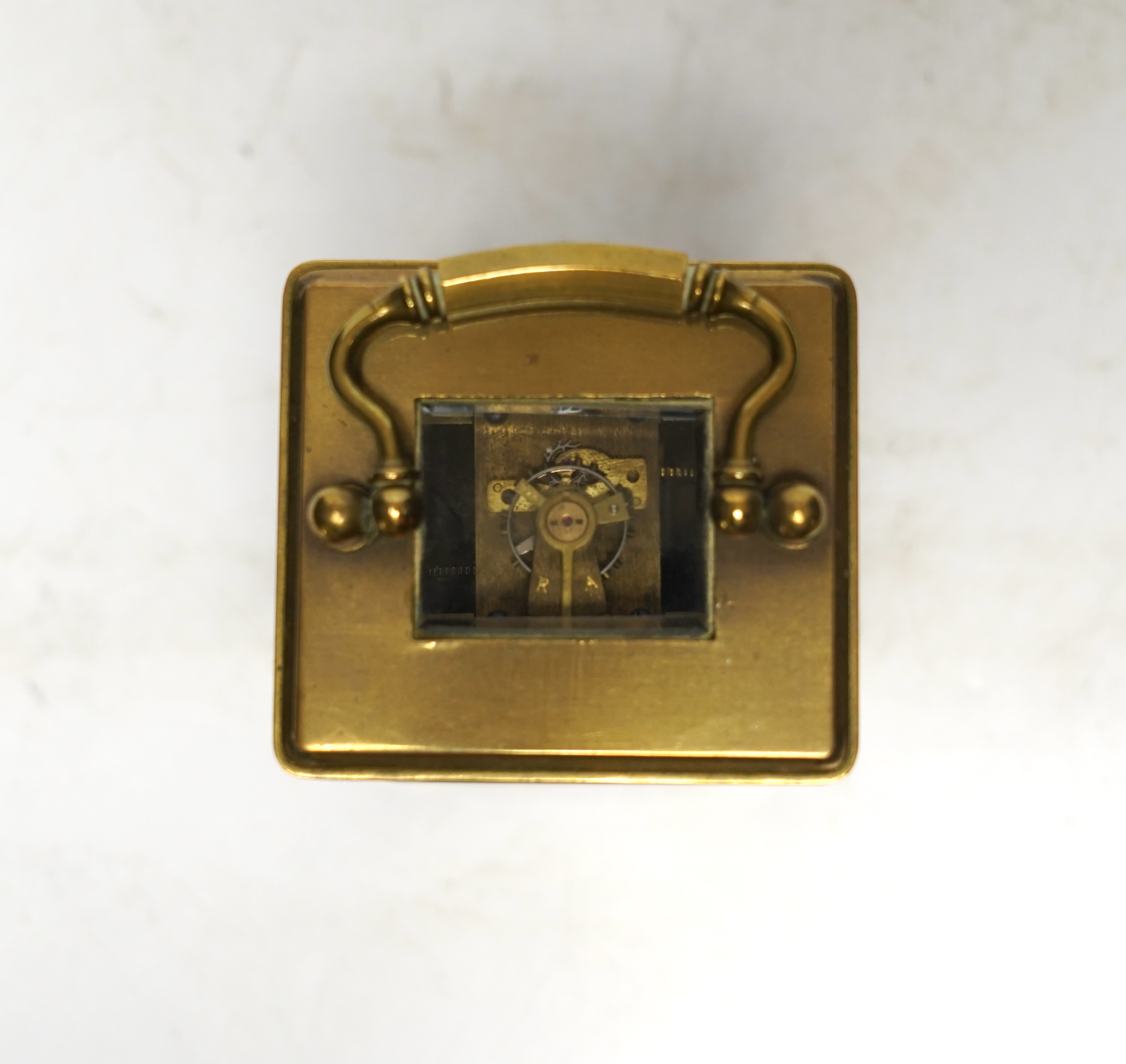 A miniature French brass carriage clock, with champlevé enamel panels, face signed Elliott & Son, London, 8.5cm